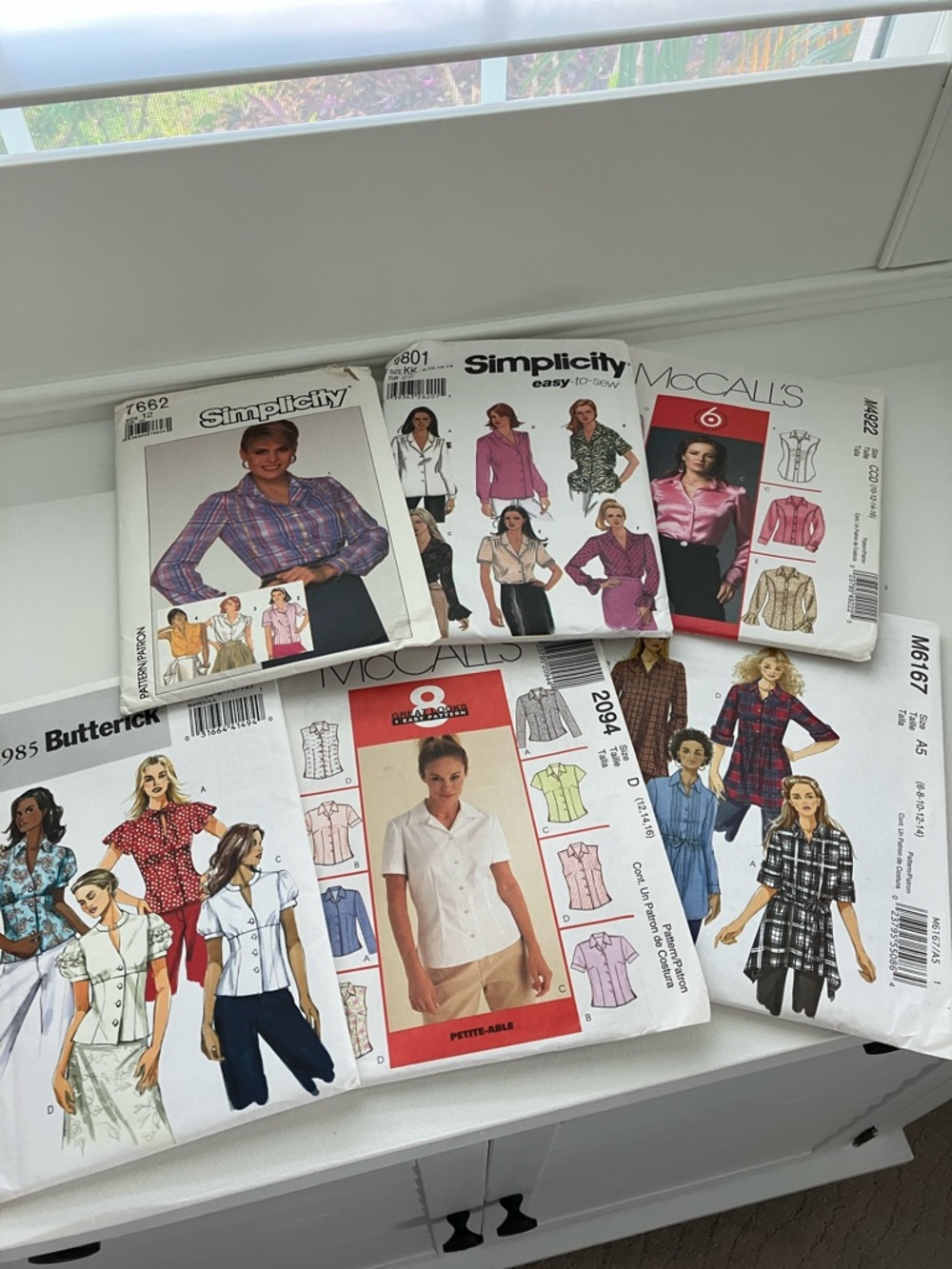 Six uncut sewing patterns, button-down blouses women’s sizes 6–16